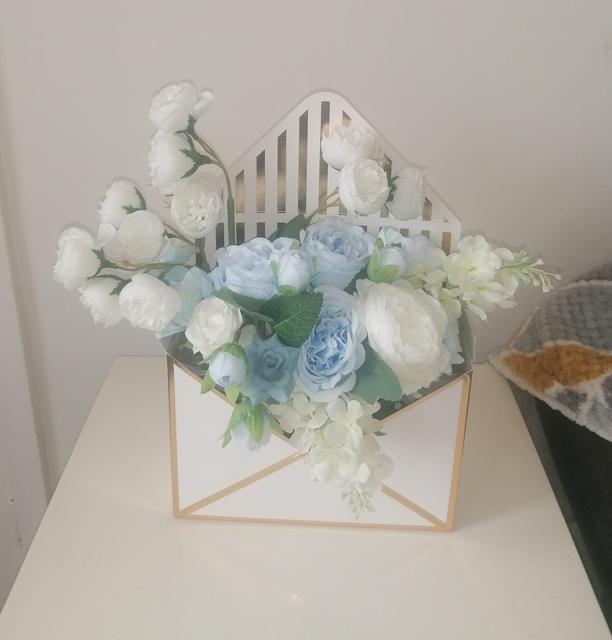 Artificial flower filled envelopes