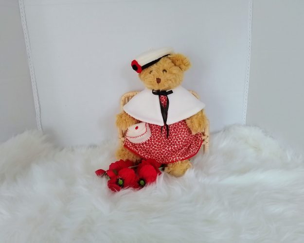Custom-clothed soft toy teddy bear (original base : Mumbles Bear) with unique, handcrafted autumn dress, cape, French beret, and handbag by Enchanting World.