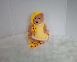 Custom-clothed teddy bear (original base : 'Bear and Me' by Charlie Bears) with unique, handcrafted summer dress and cloche hat by Enchanting World.
