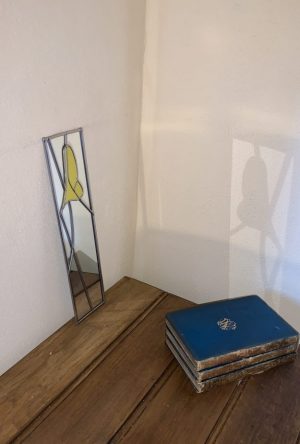 Mirror with yellow Lilly.