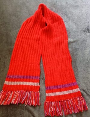 Red hand-knitted scarf